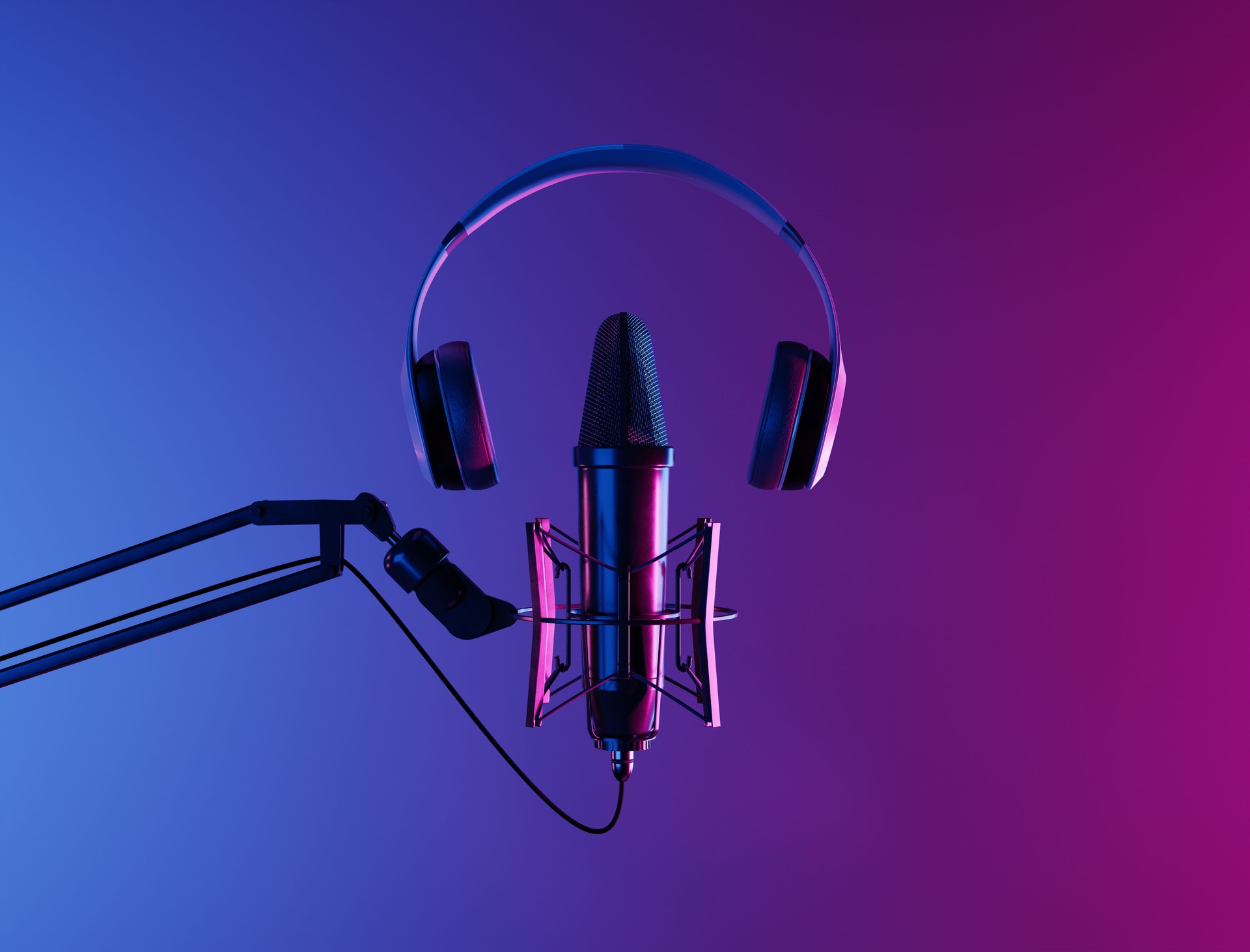 studio microphone with headphones and neon lighting